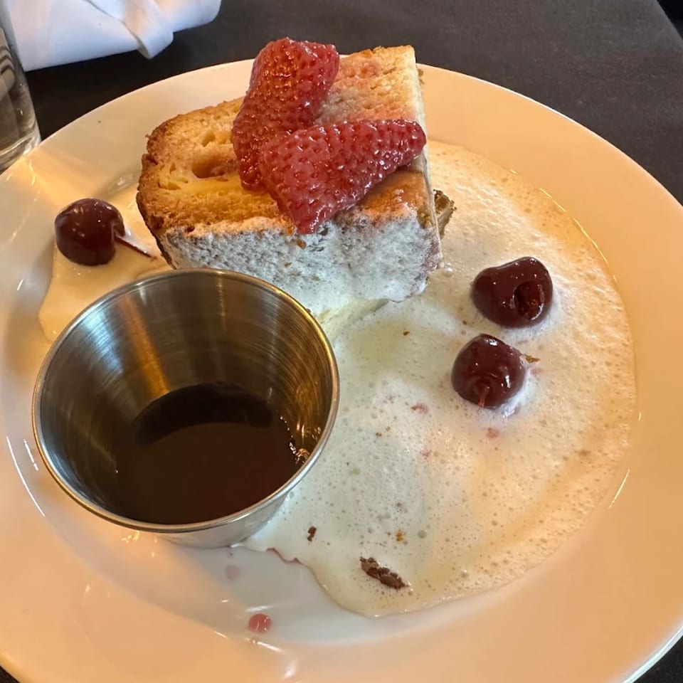 Astrid's southern-style dessert: pound cake with strawberries, cherries, and a side of syrup.